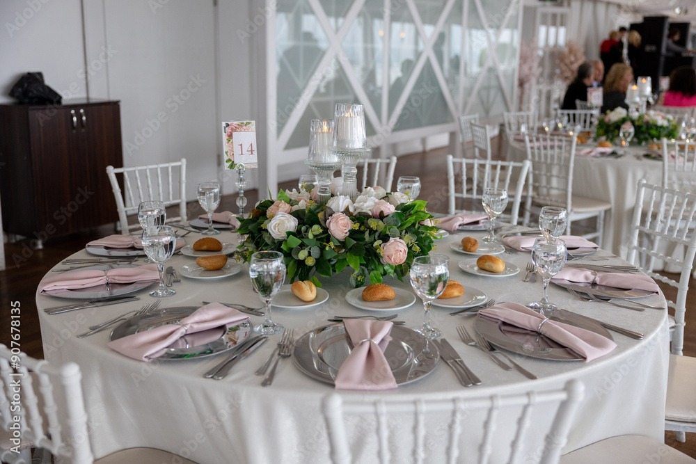 Elegant Indoor Wedding Reception with Pink and White Floral Centerpieces and Candles