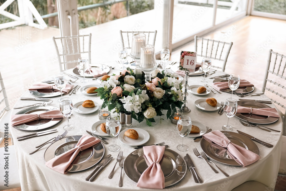 Beautiful Wedding Decor: Round Tables with Pink and White Floral Arrangements and Candles