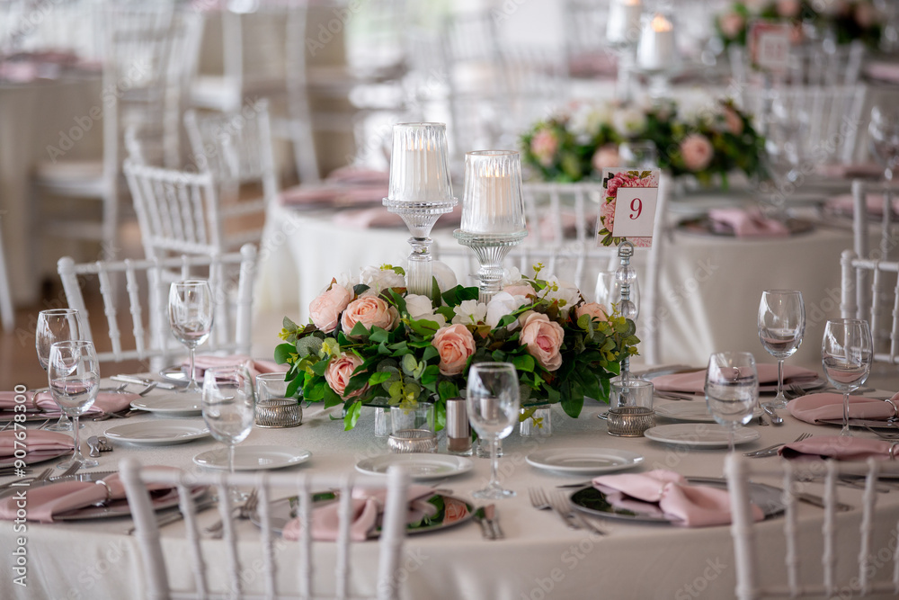 Elegant Indoor Wedding Reception with Pink and White Floral Centerpieces and Candles