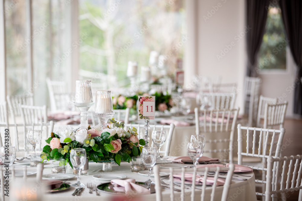 Elegant Indoor Wedding Reception with Pink and White Floral Centerpieces and Candles