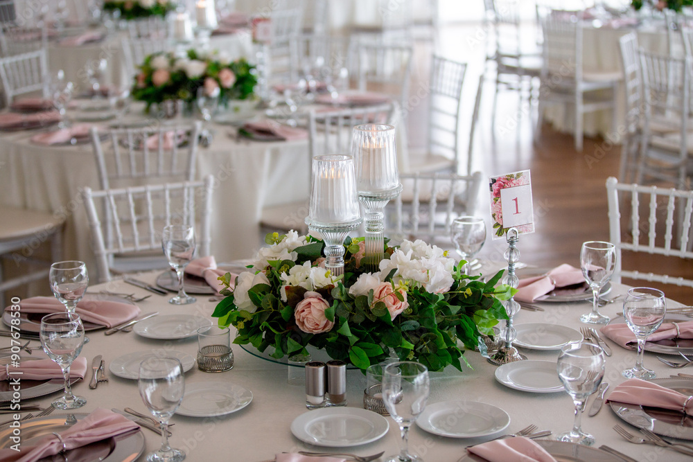 Elegant Indoor Wedding Reception with Pink and White Floral Centerpieces and Candles