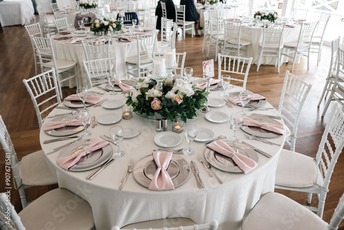 Elegant Indoor Wedding Reception with Pink and White Floral Centerpieces and Candles