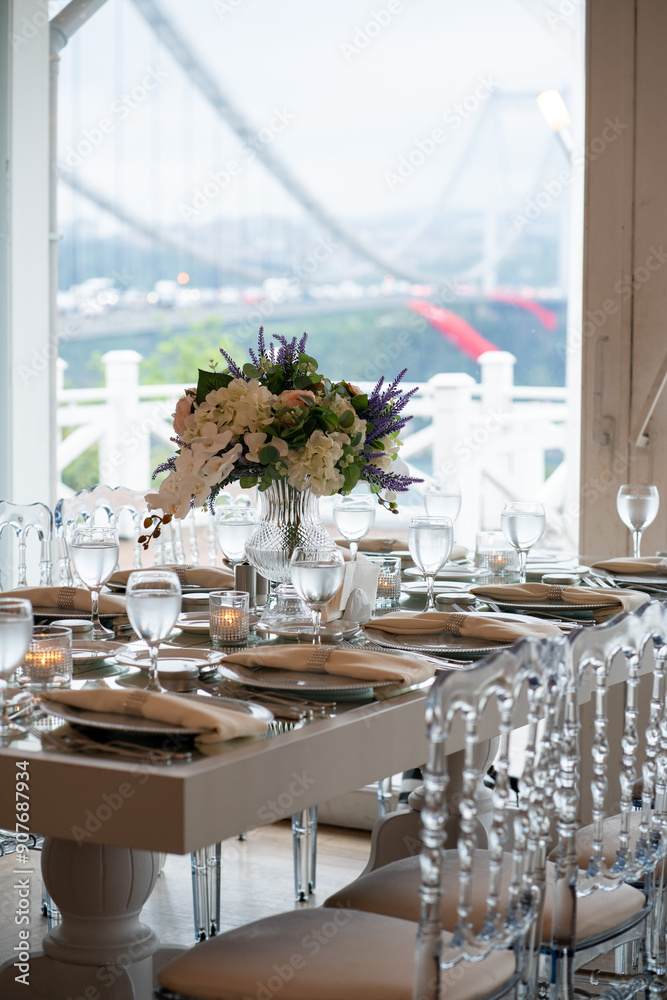 Stylish Outdoor Reception: Lounge Furniture with Floral Accents and Urban Panorama
