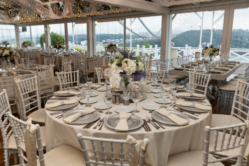Stylish Outdoor Reception: Lounge Furniture with Floral Accents and Urban Panorama
