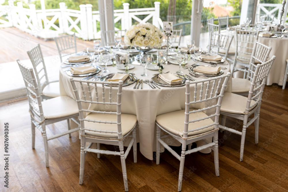 Stylish Outdoor Reception: Lounge Furniture with Floral Accents and Urban Panorama