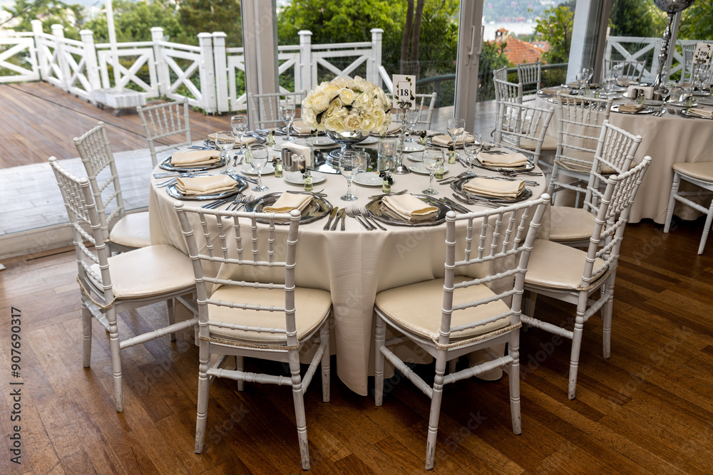 Stylish Outdoor Reception: Lounge Furniture with Floral Accents and Urban Panorama