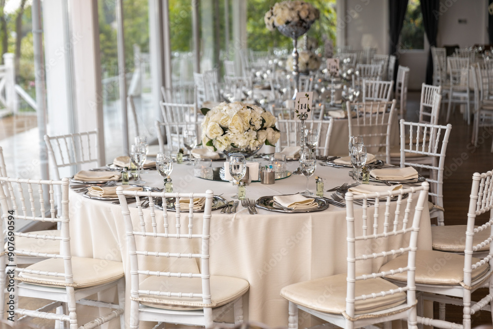 Stylish Outdoor Reception: Lounge Furniture with Floral Accents and Urban Panorama