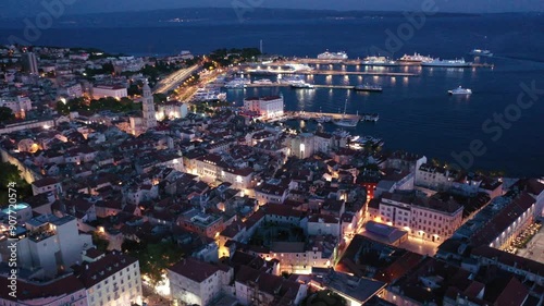 Wallpaper Mural Split Croatia night video: Illuminated cityscape, vibrant nightlife, scenic beauty. Soar above Split's illuminated harbor and witness the stunning beauty of the Adriatic coastline. Torontodigital.ca