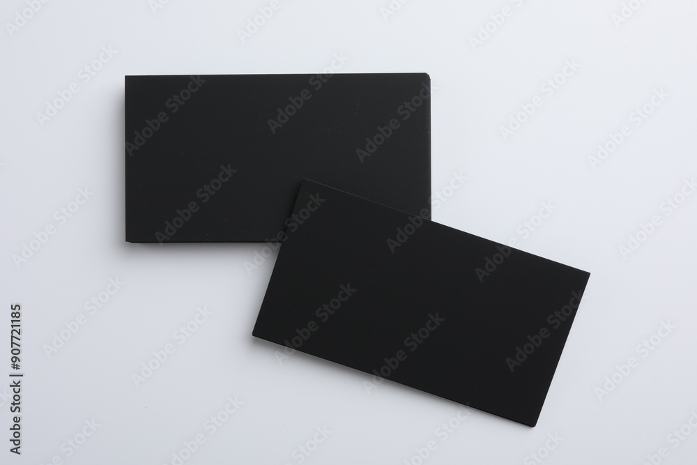 Blank business cards on light grey background, top view. Mockup for design Blank business cards on light grey background, top view. Mockup for design