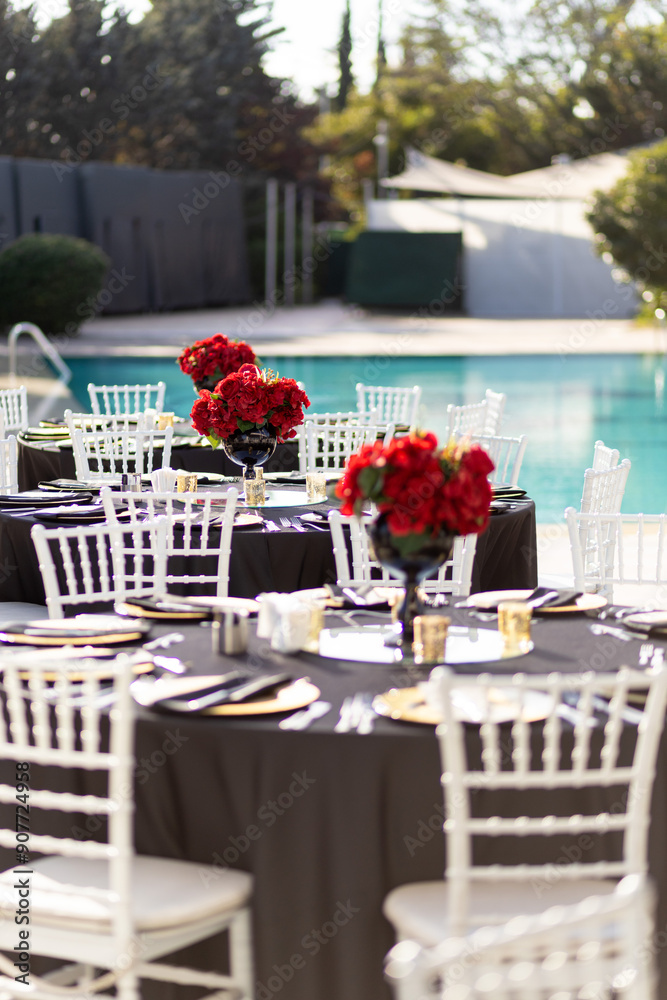 Elegant Poolside Wedding Reception with Red Rose Centerpiece