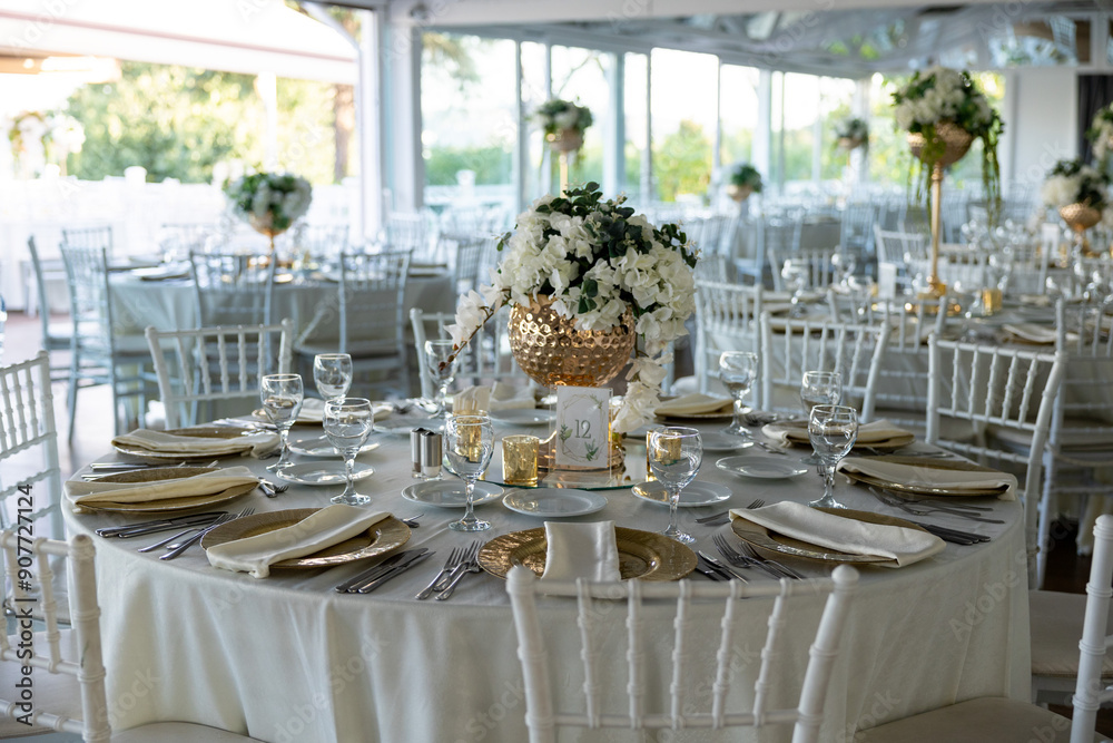 Elegant Wedding Table with White Flowers and Greenery at Outdoor Reception