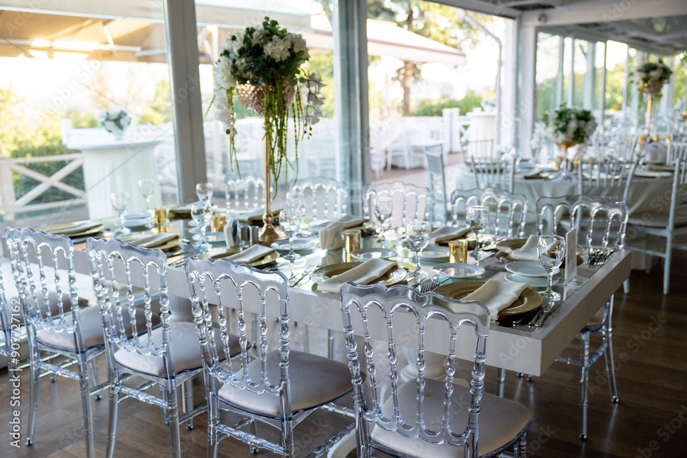 Elegant Wedding Table with White Flowers and Greenery at Outdoor Reception