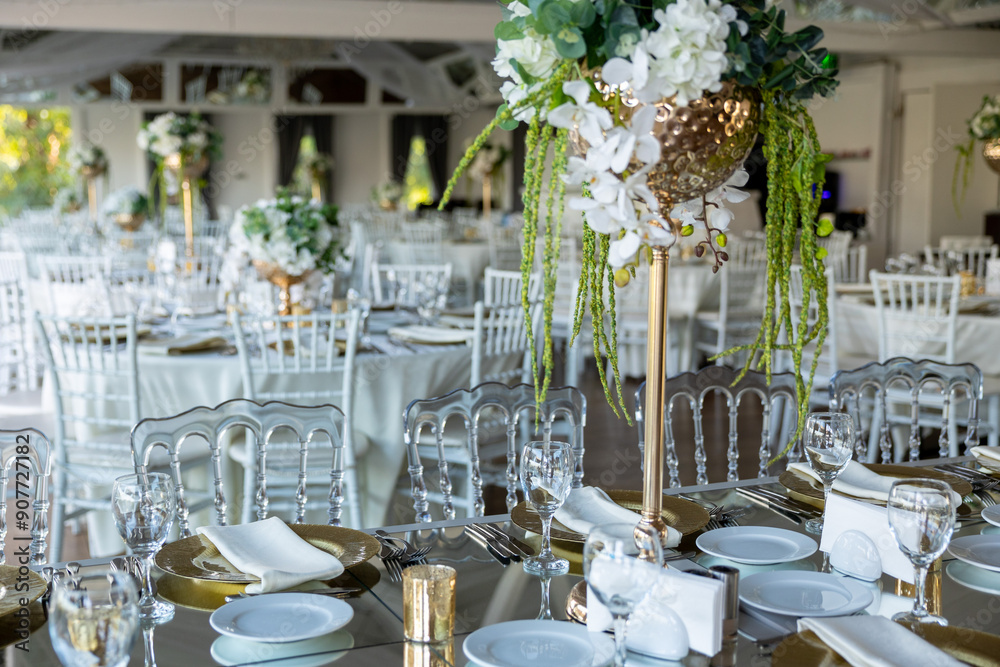 Refined Wedding Reception Table with White Floral Arrangement Outside