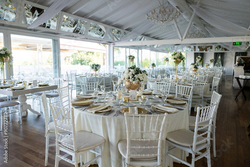 Elegant Wedding Table with White Flowers and Greenery at Outdoor Reception