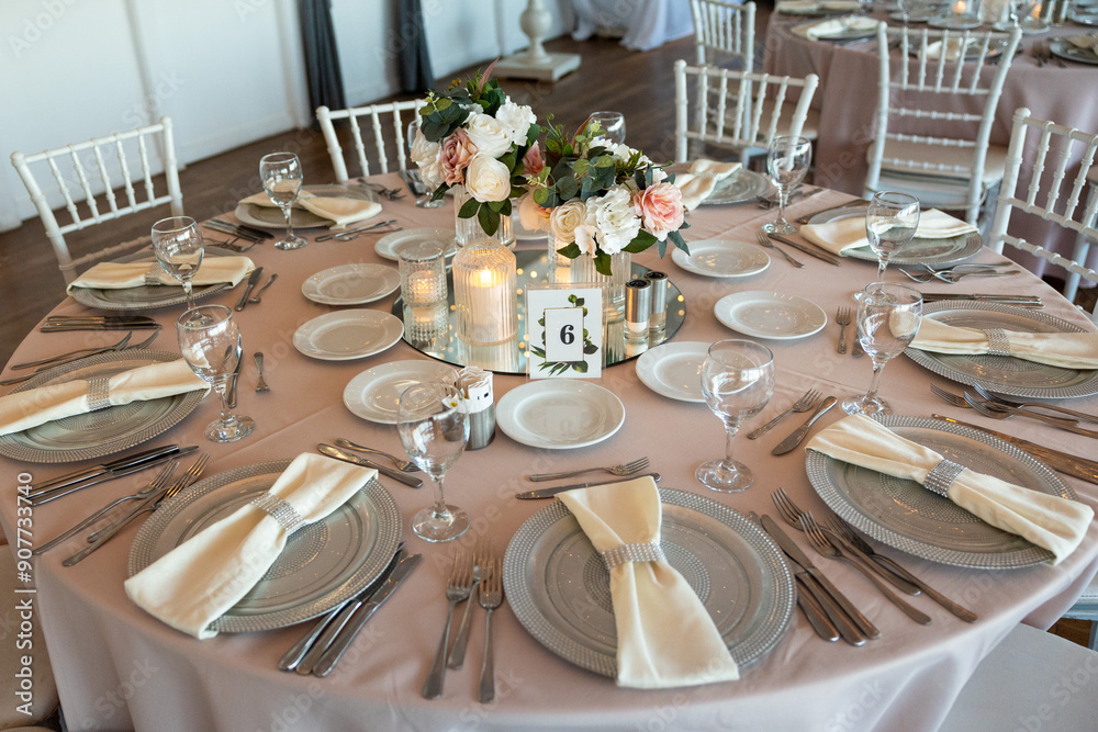 Beautifully Decorated Wedding Table with Soft Colored Centerpiece Indoors