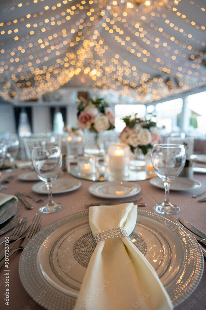 Beautifully Decorated Wedding Table with Soft Colored Centerpiece Indoors