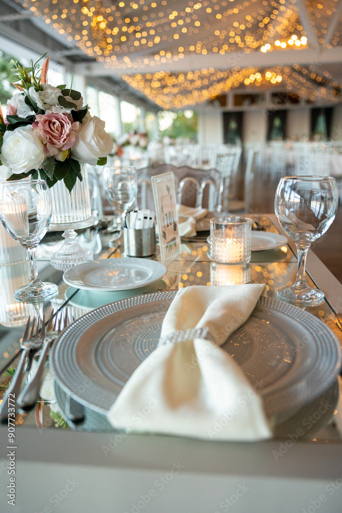 Beautifully Decorated Wedding Table with Soft Colored Centerpiece Indoors