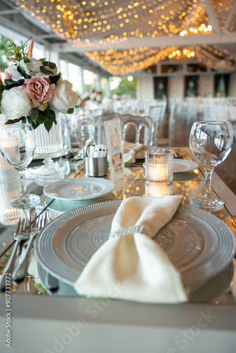 Beautifully Decorated Wedding Table with Soft Colored Centerpiece Indoors