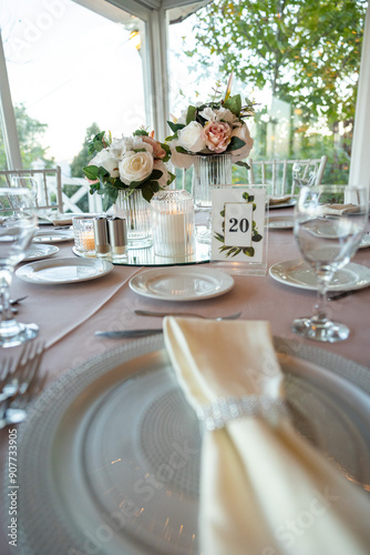 Elegant Wedding Table with Pastel Flowers and Greenery at Indoor Reception