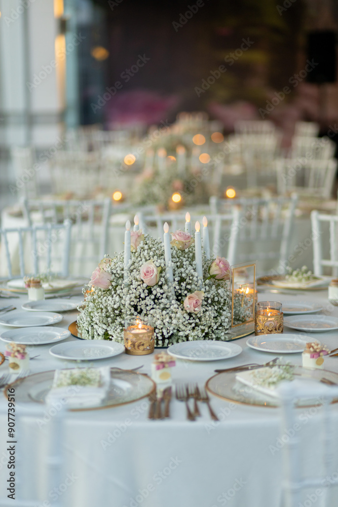 Beautifully Decorated Wedding Table with Floral Arrangement and Candles Indoors