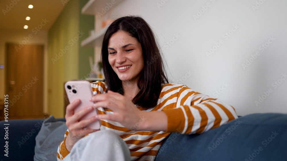 Beautiful woman enjoying at home and using smartphone Beautiful woman enjoying at home and using smartphone