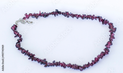 Close up shot of the necklace made of garnet stone. Fashion