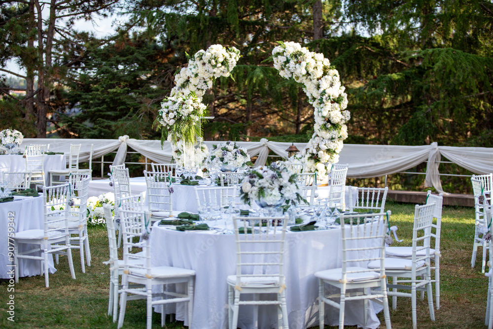 Elegant Outdoor Wedding Reception with Wisteria Floral Centerpieces