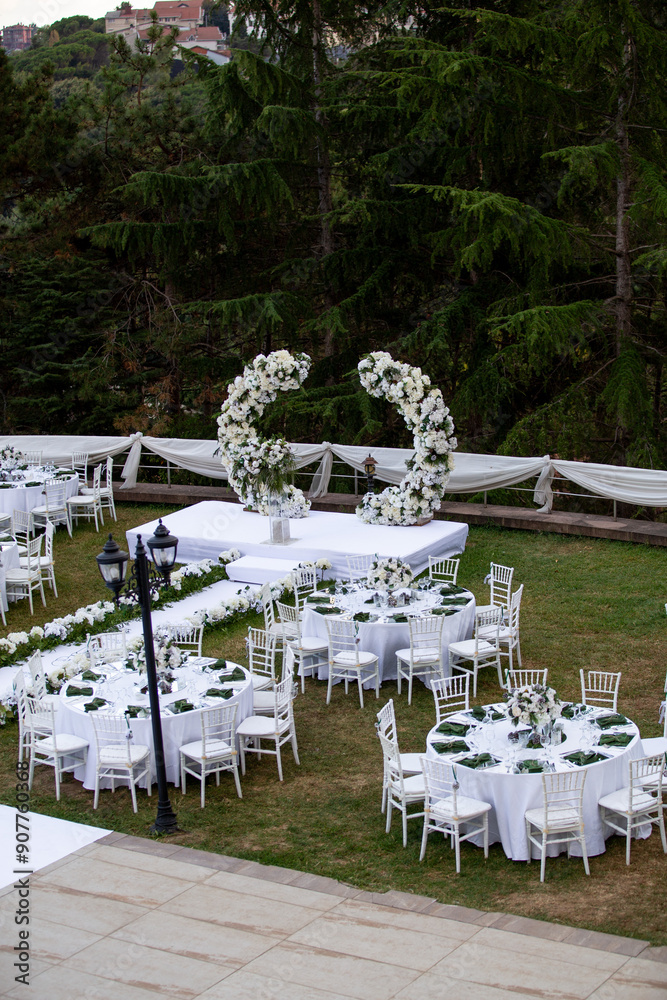 Elegant Outdoor Wedding Reception with Wisteria Floral Centerpieces