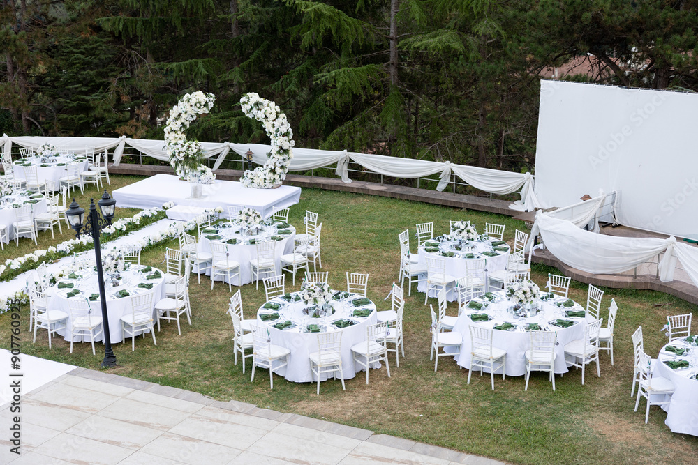 Elegant Outdoor Wedding Reception with Wisteria Floral Centerpieces