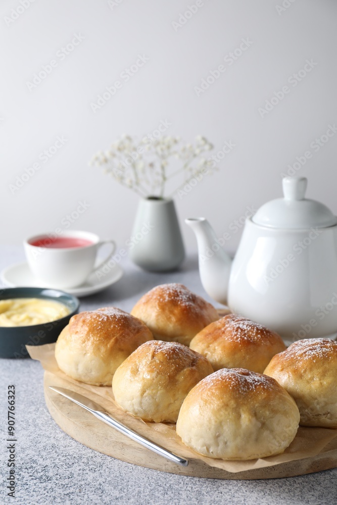 Delicious dough balls, sauce and tea on grey table, selective focus Delicious dough balls, sauce and tea on grey table, selective focus