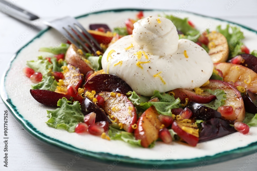 Plate with fresh burrata salad on white wooden table, closeup Plate with fresh burrata salad on white wooden table, closeup