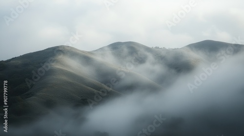 Enveloped in Mist: Mountain Peaks Under a Veil of Fog