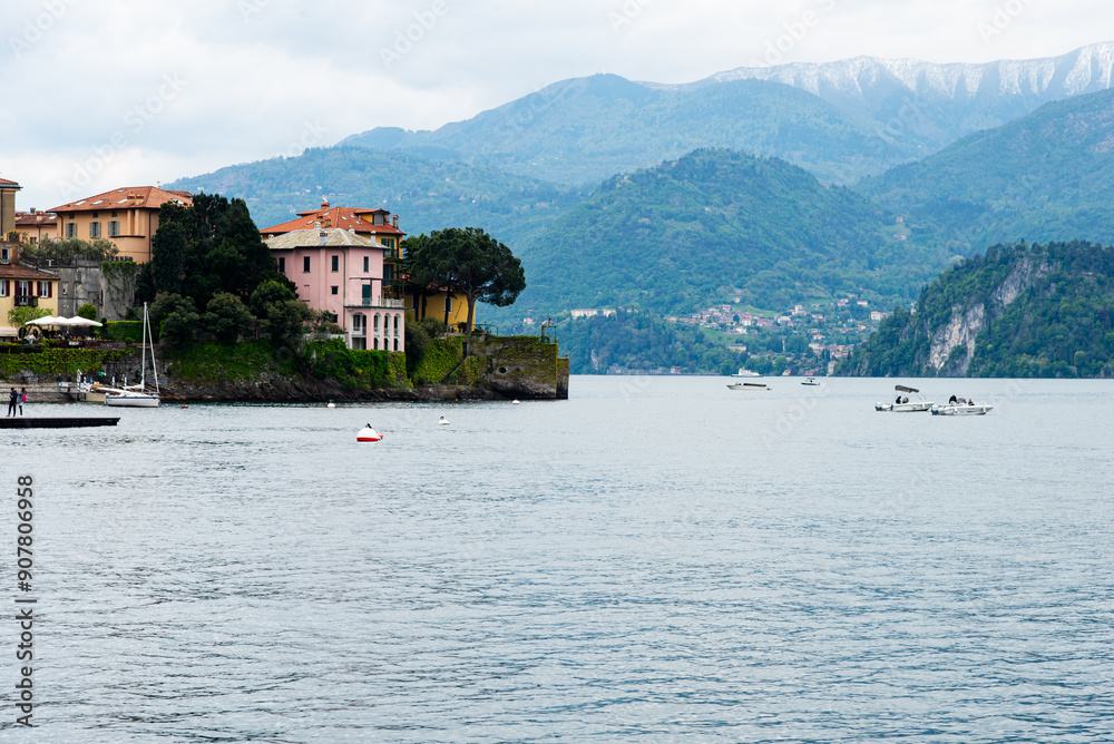 Lake como, Italy-April 26, 2024: Lakeside Houses with Mountain View Lake como, Italy-April 26, 2024: Lakeside Houses with Mountain View