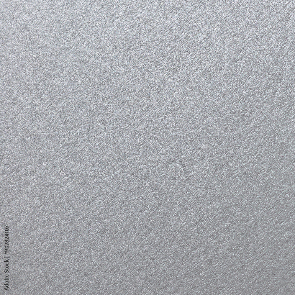 Close up of fine texture of a metallic sheet. Silver color metal plate with grainy texture background. Close up of fine texture of a metallic sheet. Silver color metal plate with grainy texture background.
