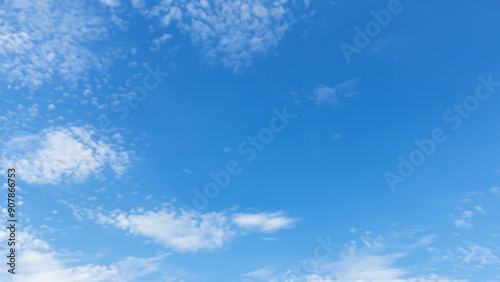 blue sky background with tiny clouds