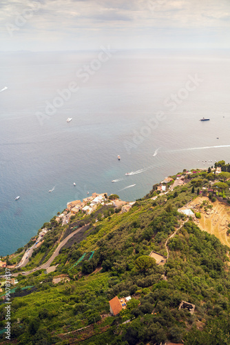 Obraz na płótnie Scenic Aerial View Of Coastal Village With Boats On Tranquil Sea w salonie