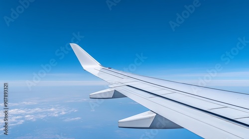 close-up of an airplane wing in mid-flight, clear blue sky, ample copy space, more clarity with clear light and sharp focus, high detailed photo