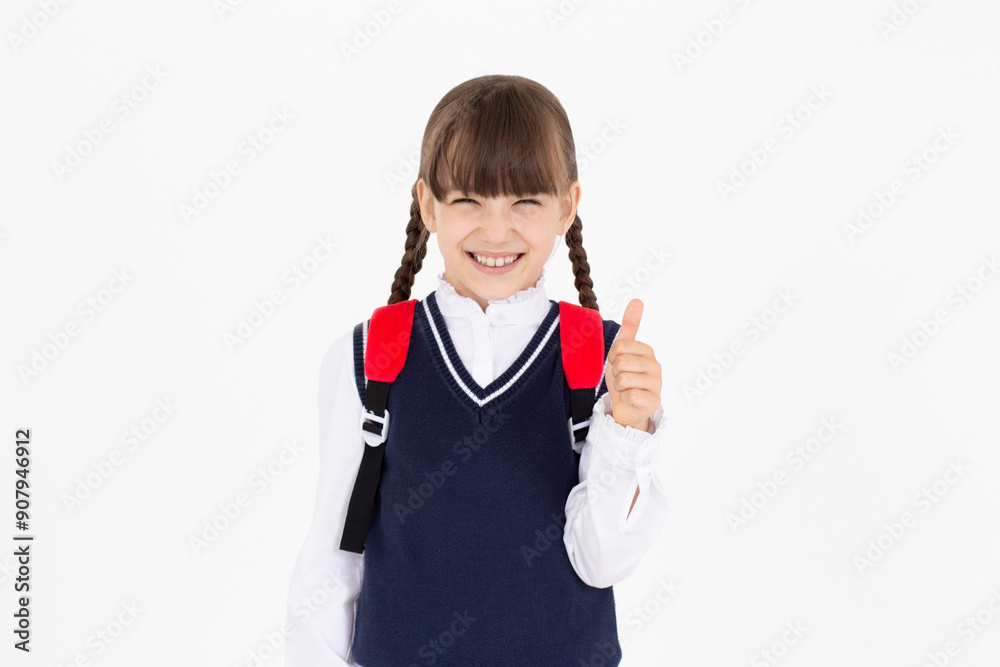 Cheerful School Girl Gesturing Thumbs-Up Smiling To Camera Posing Over white Studio Background. I Like School Concept. Panorama