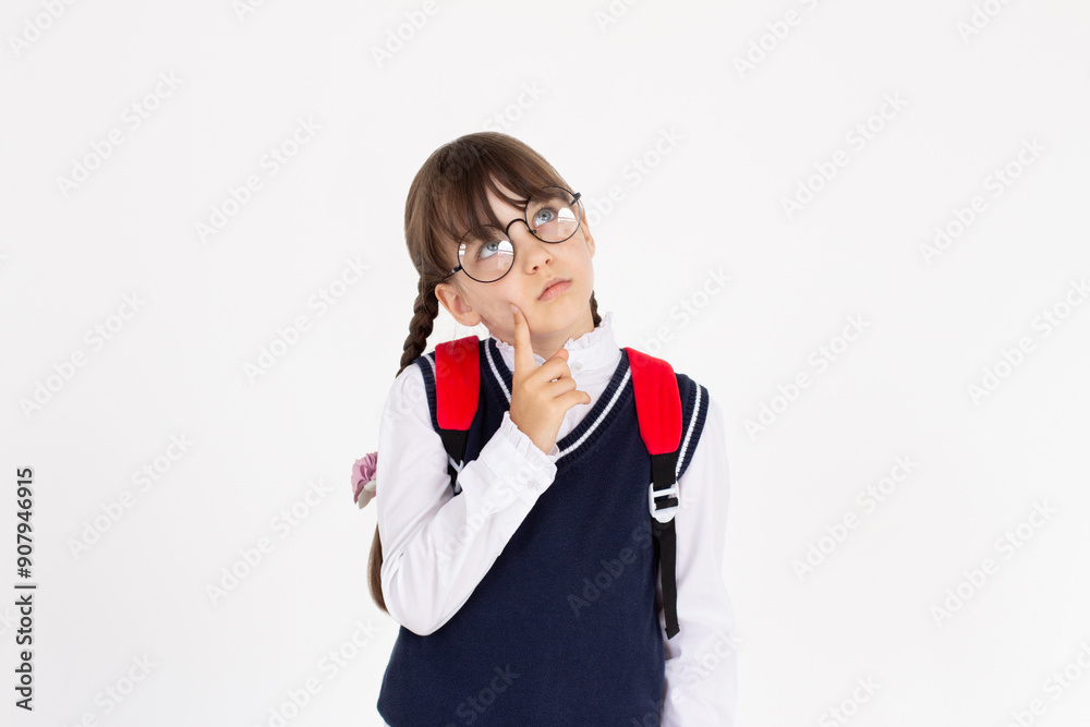 Thoughtful deciding schoolgirl in glasses with backpack, preteen kid thinking looking at copy space having question, making choice. Kid student advertising standing isolated on white background Thoughtful deciding schoolgirl in glasses with backpack, preteen kid thinking looking at copy space having question, making choice. Kid student advertising standing isolated on white background