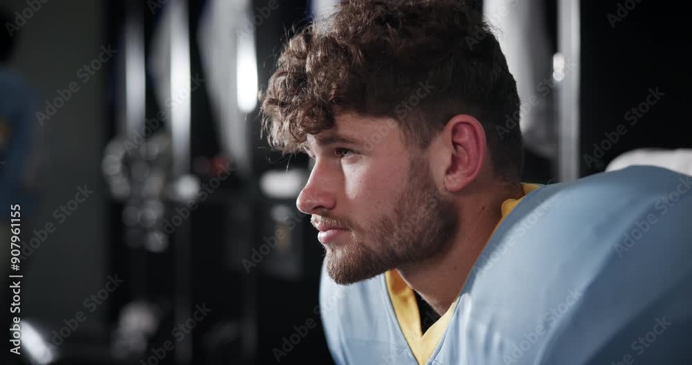 Football, thinking and man in locker room ready for playing in match, game and competition. Sports, athlete and person prepare for training, exercise and workout for fitness, practice and tournament Football, thinking and man in locker room ready for playing in match, game and competition. Sports, athlete and person prepare for training, exercise and workout for fitness, practice and tournament