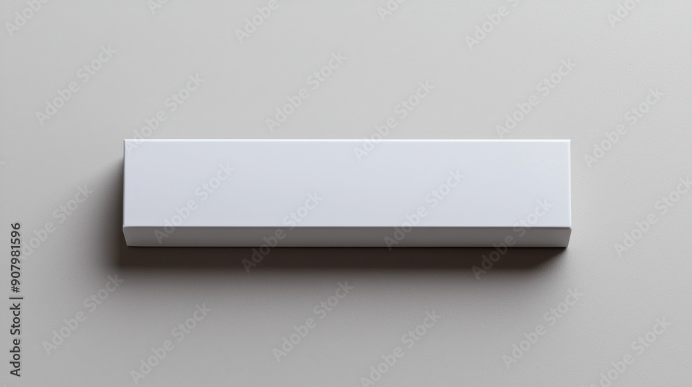 White rectangular box viewed from the top at a far angle, showcasing its clean and minimalistic design. White rectangular box viewed from the top at a far angle, showcasing its clean and minimalistic design.