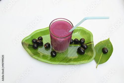 Syzygium cumini fruits juice. Its other names Malabar plum, Java plum, black plum, jamun and  jambolan. This fruit have anti diabetic properties. Indian jamun juice. Healthy drink. Fruit juice. photo