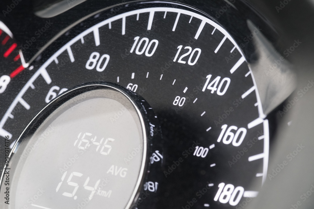 Close-up of car speedometer with digital display showing average speed and time Close-up of car speedometer with digital display showing average speed and time