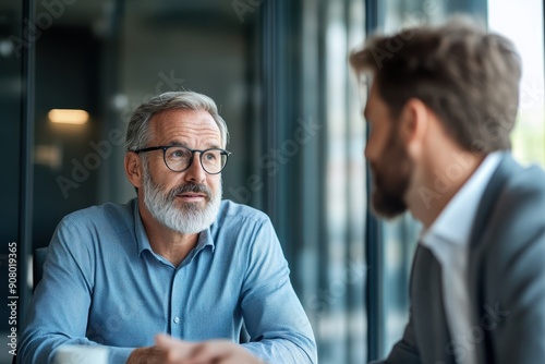 Strategic Corporate Finance Consultation between Financial Adviser and Executive in Profile View