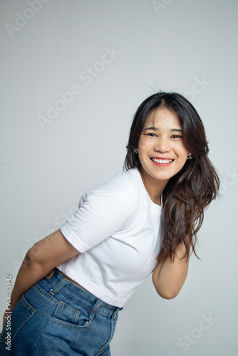 a woman with long hair smiled and wore a white shirt. isolated white background