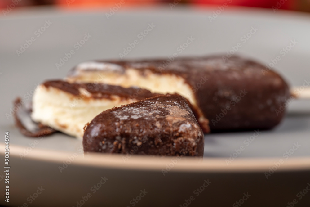 delicious creamy ice cream in chocolate glaze on a plate delicious creamy ice cream in chocolate glaze on a plate