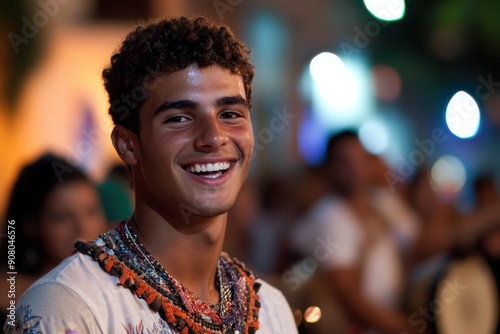 Young Man Smiling Joyfully at Night Festival Surrounded by Colorful Decorations and Lights