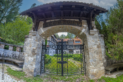 The entrance of the Economat Hotel, a building with 60 rooms built in 1900 in the German Renaissance style and extended in 1908-1909. Part of the Peles castle complex buildings, Sinaia, Romania. photo