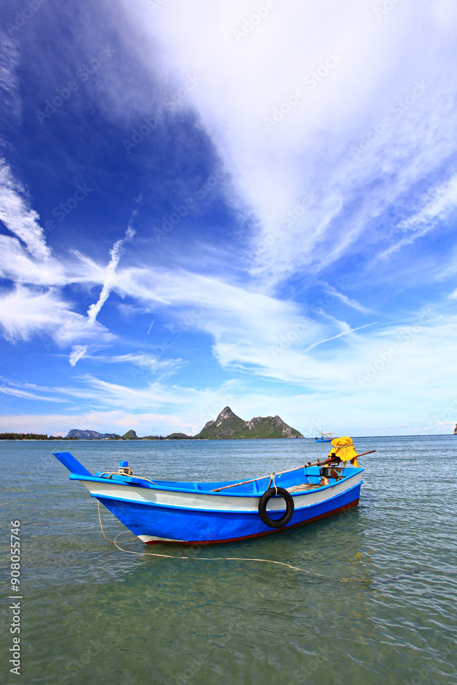 Naklejka premium Fishing boat moored in Ao Manao Behind it is a Khao Lom Muak Prachuap Khiri Khan Province 