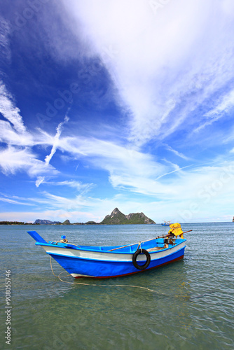 Fishing boat moored in Ao Manao Behind it is a Khao Lom Muak Prachuap Khiri Khan Province  photo